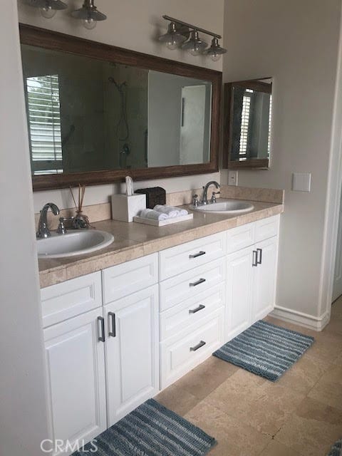 3401 5th Ave, Corona Del Mar, CA 92625 - bathroom with double vanity and a shower with shower door