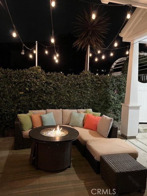 3401 5th Ave, Corona Del Mar, CA 92625 - patio at night with an outdoor living space with a fire pit