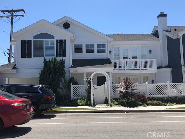 3401 5th Ave, Corona Del Mar, CA 92625 - view of front of home featuring a balcony and a chimney