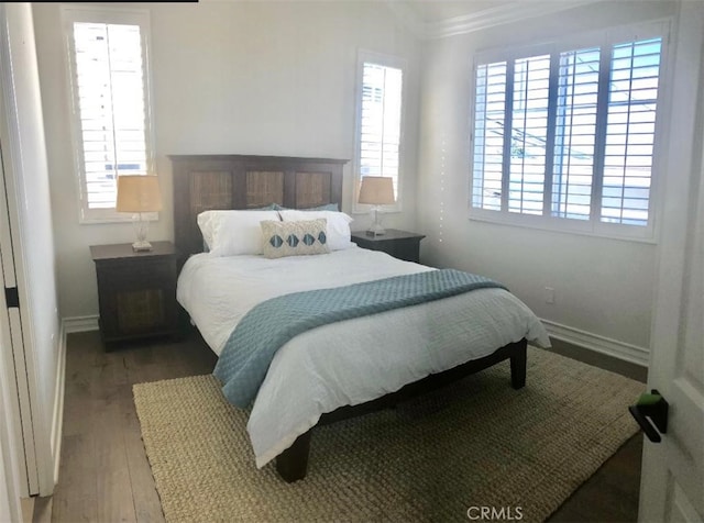 3401 5th Ave, Corona Del Mar, CA 92625 - bedroom featuring ornamental molding, multiple windows, wood finished floors, and baseboards