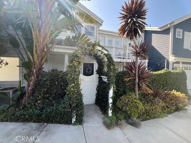 3401 5th Ave, Corona Del Mar, CA 92625 - view of front facade featuring cooling unit, a balcony, and an attached garage