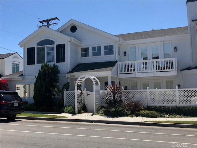3401 5th Ave, Corona Del Mar, CA 92625 - view of front of house featuring a balcony and a shingled roof