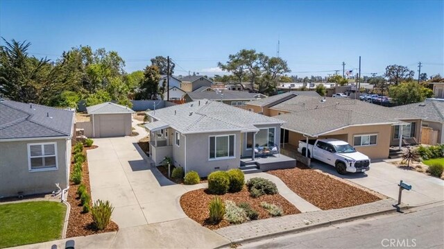 715 Bennett Ave, Arroyo Grande, CA 93420 - view of front of house featuring driveway, a garage, a residential view, and stucco siding