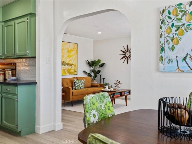 715 Bennett Ave, Arroyo Grande, CA 93420 - dining room featuring arched walkways, light wood finished floors, baseboards, recessed lighting, and crown molding