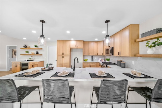 29140 Via Norte, Temecula, CA 92591 - kitchen with open shelves, stainless steel appliances, beverage cooler, light brown cabinets, and a peninsula