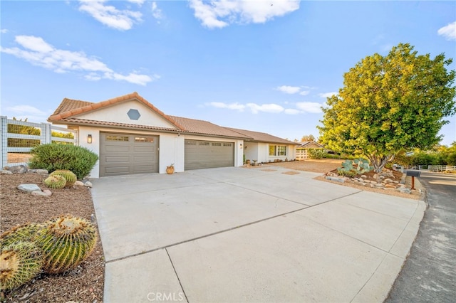 29140 Via Norte, Temecula, CA 92591 - view of front of house with a garage, concrete driveway, stucco siding, and a tile roof