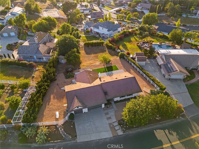 aerial view of property and surrounding area featuring nearby suburban area