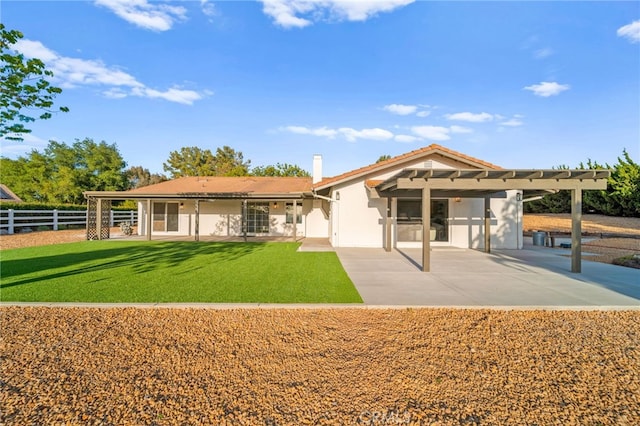 back of house featuring a pergola, a patio, and stucco siding