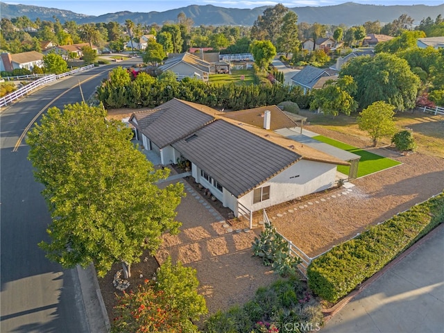 aerial view of residential area featuring mountains
