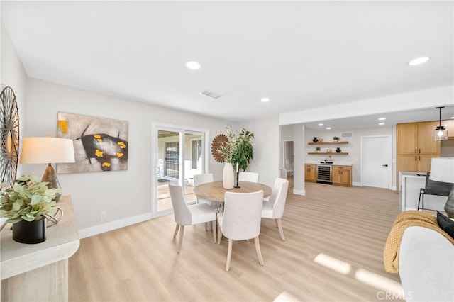 29140 Via Norte, Temecula, CA 92591 - dining space featuring beverage cooler, light wood finished floors, recessed lighting, and bar