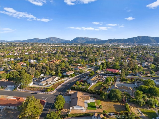 aerial view of residential area featuring a mountain backdrop