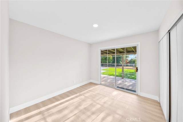 29140 Via Norte, Temecula, CA 92591 - unfurnished bedroom with access to outside, light wood finished floors, recessed lighting, and a closet