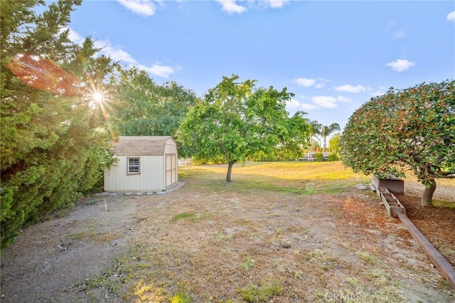 view of yard with a storage shed and an outdoor structure