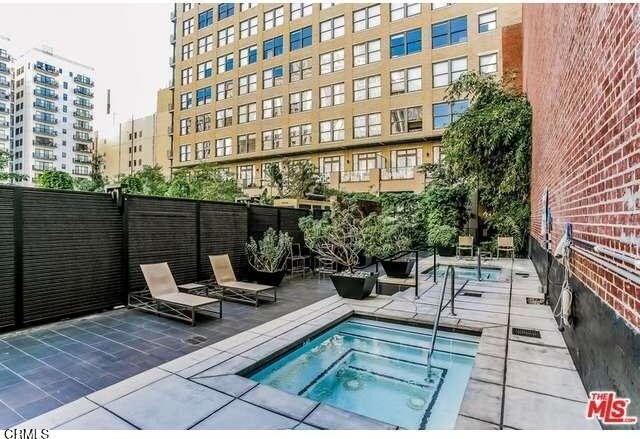 460 S Spring St Unit 713, Los Angeles, CA 90013 - view of pool with a community hot tub and a patio area