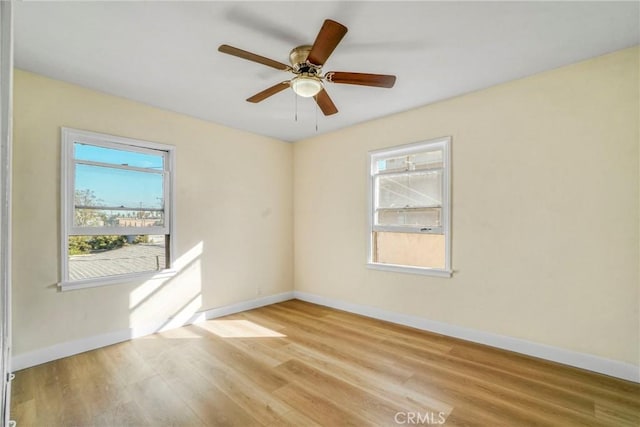 1922 Locust Ave, Long Beach, CA 90806 - empty room featuring healthy amount of natural light, baseboards, and wood finished floors