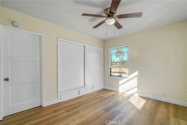 1922 Locust Ave, Long Beach, CA 90806 - unfurnished bedroom with baseboards, wood finished floors, a closet, and ceiling fan