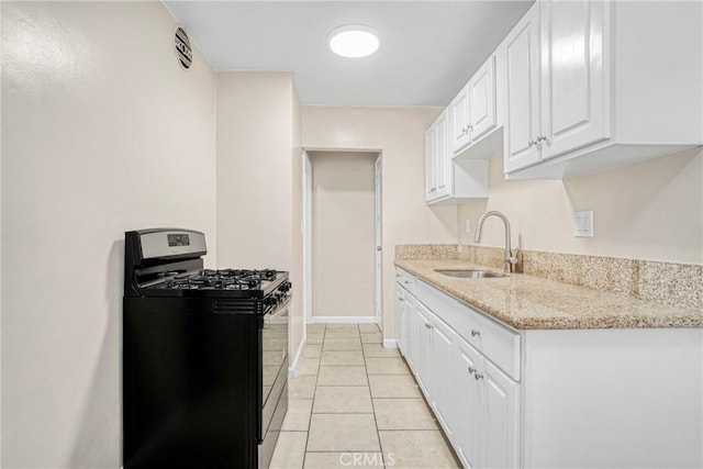 1922 Locust Ave, Long Beach, CA 90806 - kitchen featuring stainless steel gas stove, a sink, white cabinets, light tile patterned floors, and light stone countertops