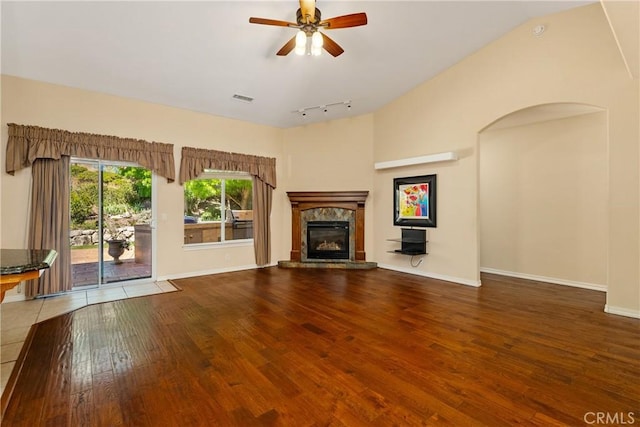 9539 Carmel Rd, Atascadero, CA 93422 - unfurnished living room featuring wood finished floors, a premium fireplace, ceiling fan, track lighting, and baseboards