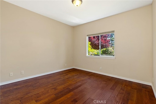 9539 Carmel Rd, Atascadero, CA 93422 - empty room with baseboards and dark wood-type flooring