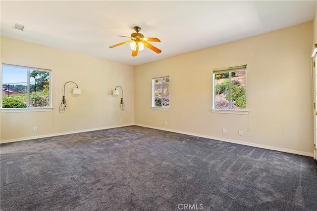 9539 Carmel Rd, Atascadero, CA 93422 - spare room featuring plenty of natural light, a ceiling fan, and dark carpet