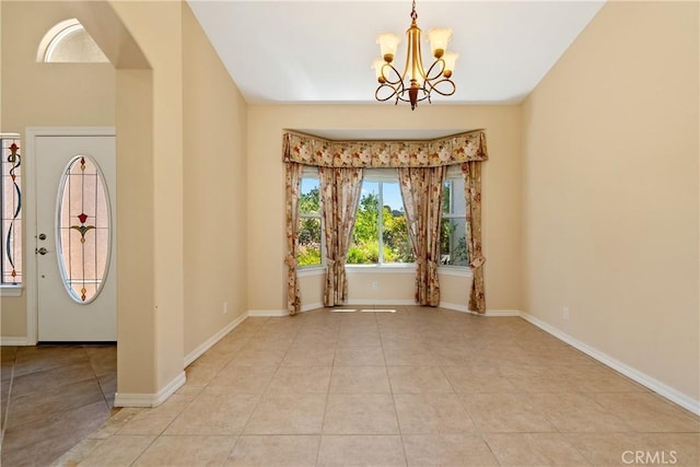 9539 Carmel Rd, Atascadero, CA 93422 - spare room with a chandelier, tile patterned floors, and baseboards