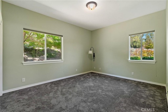 9539 Carmel Rd, Atascadero, CA 93422 - spare room featuring dark colored carpet, healthy amount of natural light, and baseboards