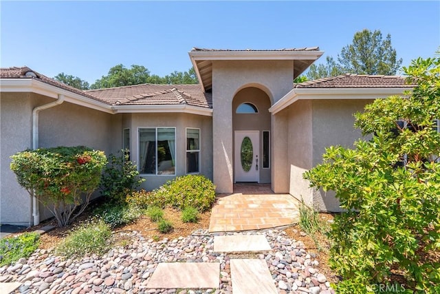 9539 Carmel Rd, Atascadero, CA 93422 - doorway to property featuring stucco siding and a tile roof