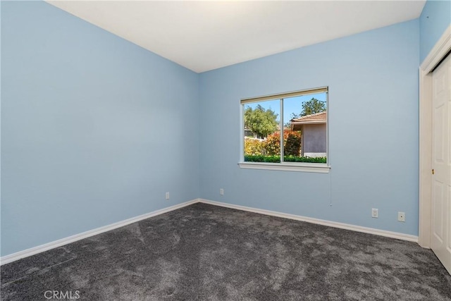 9539 Carmel Rd, Atascadero, CA 93422 - empty room featuring dark colored carpet and baseboards