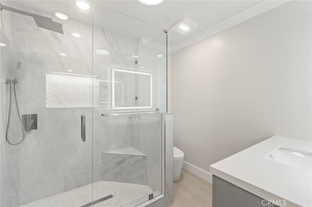 2202 Via Mariposa E Unit B, Laguna Woods, CA 92637 - full bath featuring a marble finish shower, baseboards, toilet, vanity, and wood finished floors