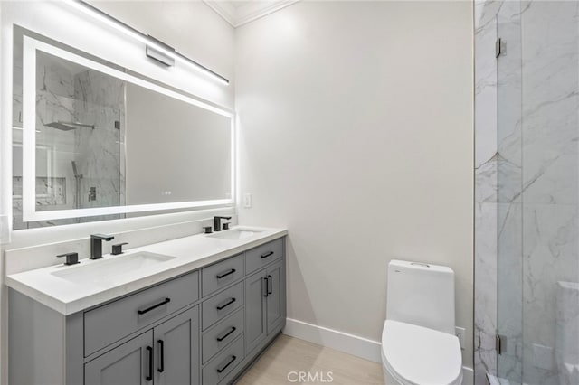 2202 Via Mariposa E Unit B, Laguna Woods, CA 92637 - full bathroom featuring a marble finish shower, crown molding, toilet, and double vanity
