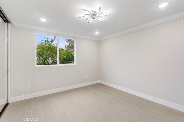 2202 Via Mariposa E Unit B, Laguna Woods, CA 92637 - unfurnished room featuring light wood finished floors, ornamental molding, recessed lighting, and baseboards