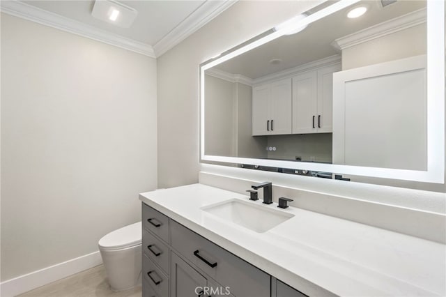 2202 Via Mariposa E Unit B, Laguna Woods, CA 92637 - bathroom with baseboards, ornamental molding, vanity, toilet, and wood finished floors