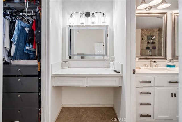 full bathroom with vanity, a walk in closet, and a tile shower