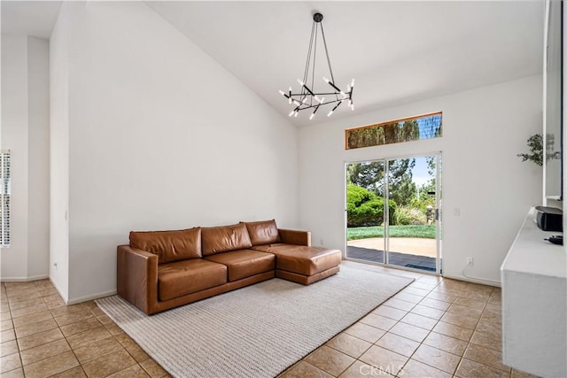 living room with high vaulted ceiling, a chandelier, light tile patterned floors, and baseboards