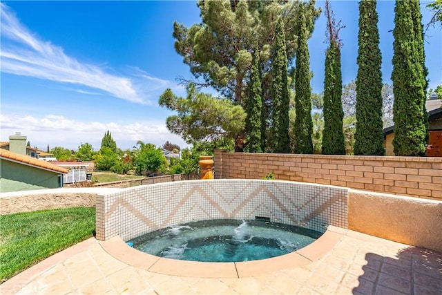 view of swimming pool featuring an in-ground hot tub