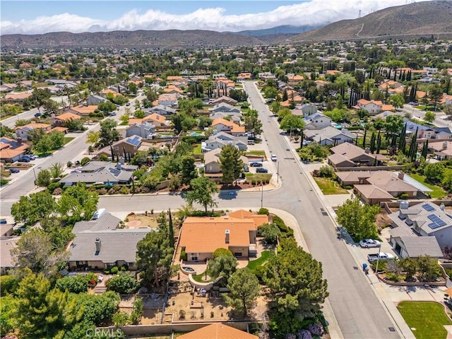 aerial perspective of suburban area with a mountainous background
