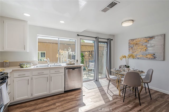 762 Dragonfly Ct, San Jose, CA 95133 - kitchen with stainless steel appliances, a sink, white cabinetry, wood finished floors, and light countertops