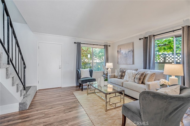 762 Dragonfly Ct, San Jose, CA 95133 - living area with ornamental molding, stairway, wood finished floors, and healthy amount of natural light