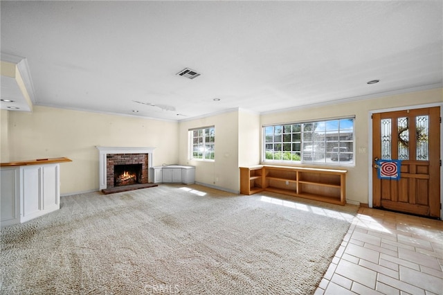 unfurnished living room featuring ornamental molding, a brick fireplace, baseboards, and recessed lighting