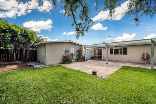 back of property featuring stucco siding and a patio area