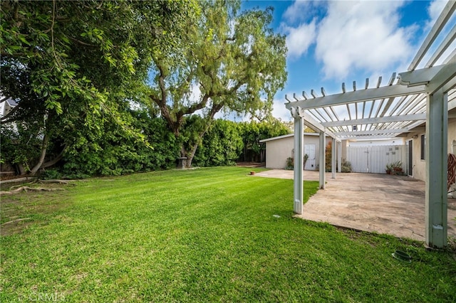 view of green lawn featuring a patio and a pergola