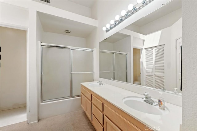 25141 La Jolla Way Unit F, Laguna Niguel, CA 92677 - bathroom featuring a shower with door, toilet, and double vanity