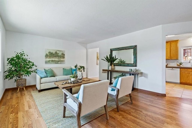 1360 El Moro Ave, Los Osos, CA 93402 - living area with light wood-type flooring and baseboards