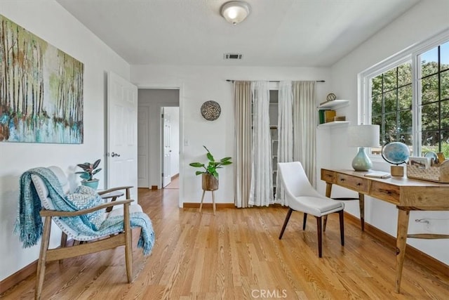 1360 El Moro Ave, Los Osos, CA 93402 - living area with light wood-style flooring and baseboards