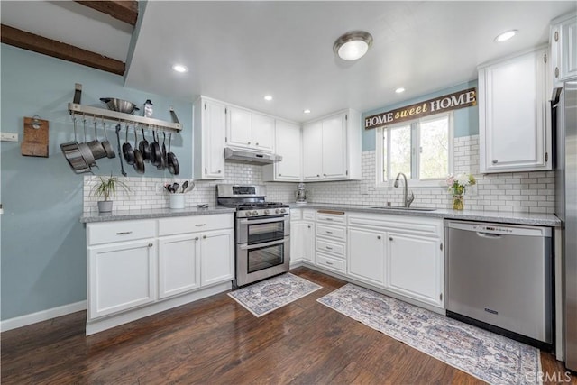 2871 Anza Ln, Costa Mesa, CA 92626 - kitchen with stainless steel appliances, a sink, under cabinet range hood, dark wood-type flooring, and recessed lighting