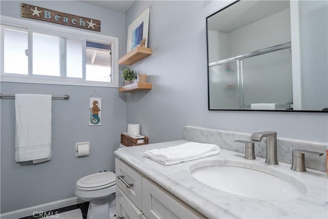 2871 Anza Ln, Costa Mesa, CA 92626 - full bath featuring vanity, an enclosed shower, toilet, and baseboards