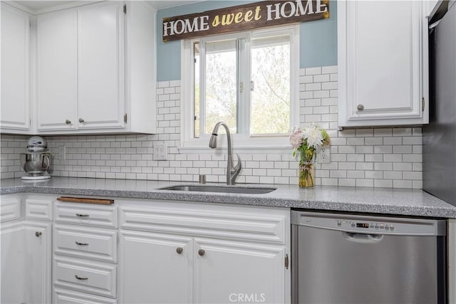 2871 Anza Ln, Costa Mesa, CA 92626 - kitchen with dishwasher, a sink, white cabinets, and tasteful backsplash
