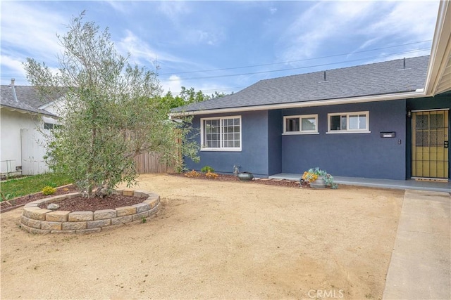 2871 Anza Ln, Costa Mesa, CA 92626 - exterior space featuring stucco siding and roof with shingles