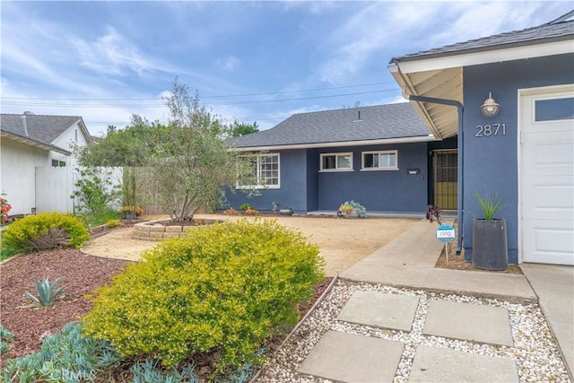 2871 Anza Ln, Costa Mesa, CA 92626 - view of front of house featuring stucco siding and roof with shingles