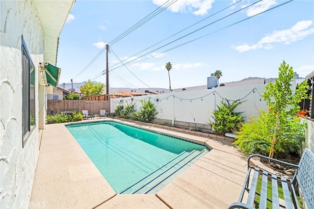 54415 Eisenhower Dr, La Quinta, CA 92253 - view of pool featuring a fenced backyard and a patio